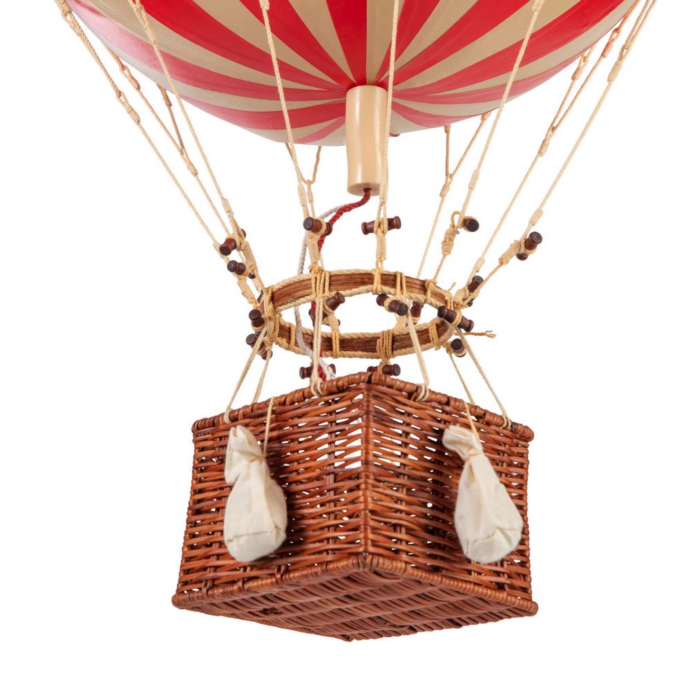 Hot air balloon with red and white striped balloon and wicker basket on a white background