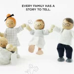 Toy family with a baby and two adults on a white background