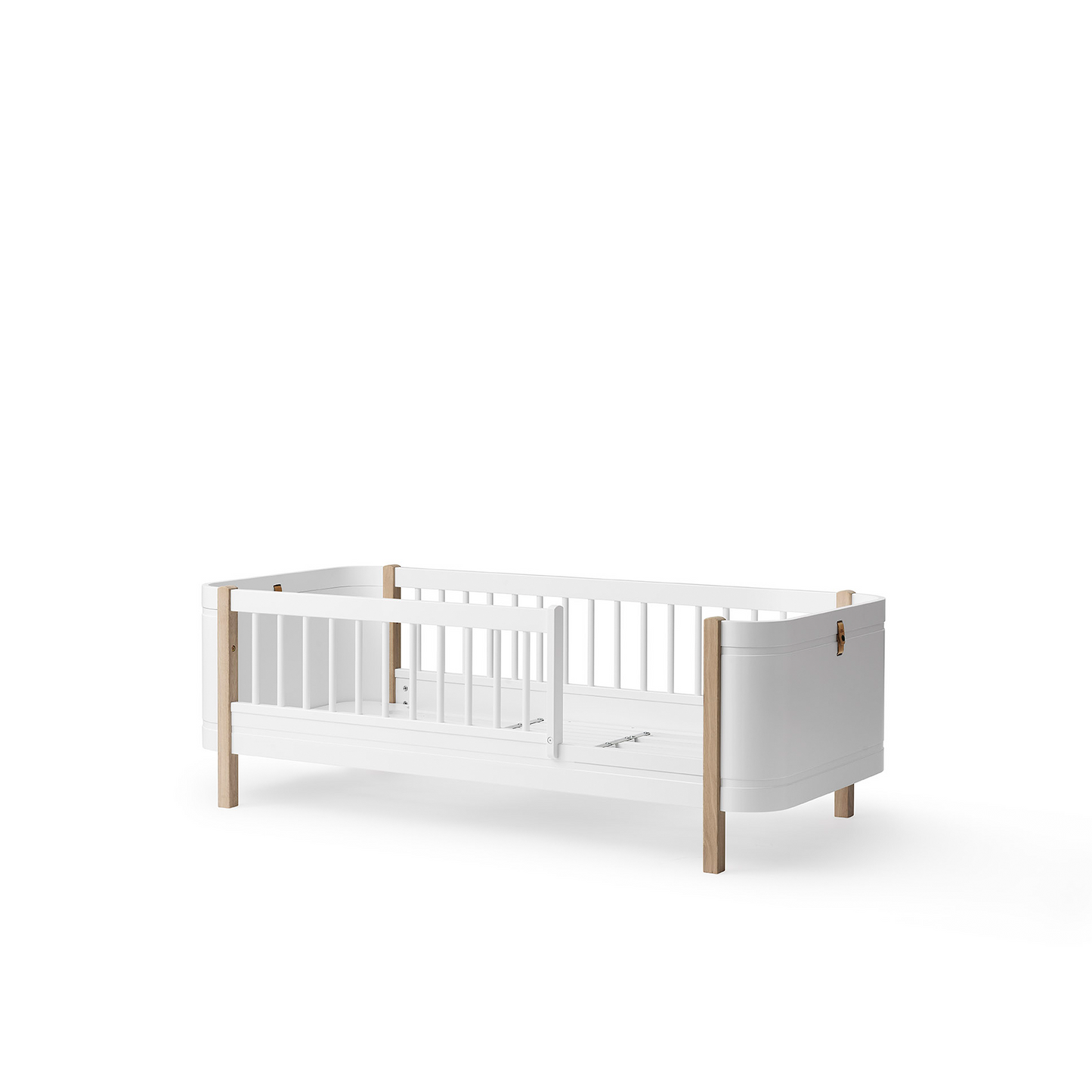 White crib with wooden accents on a white background