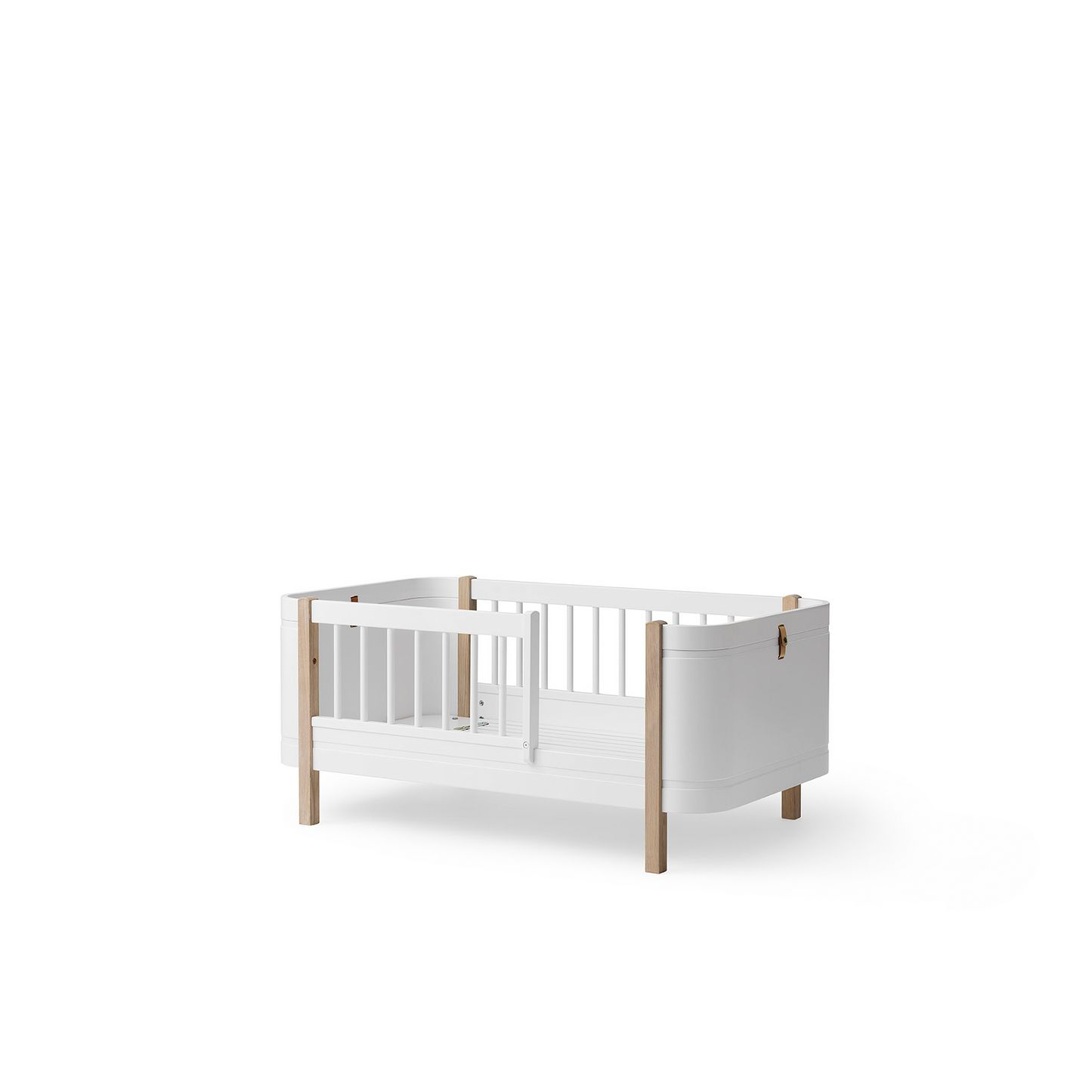 White crib with wooden accents on a white background
