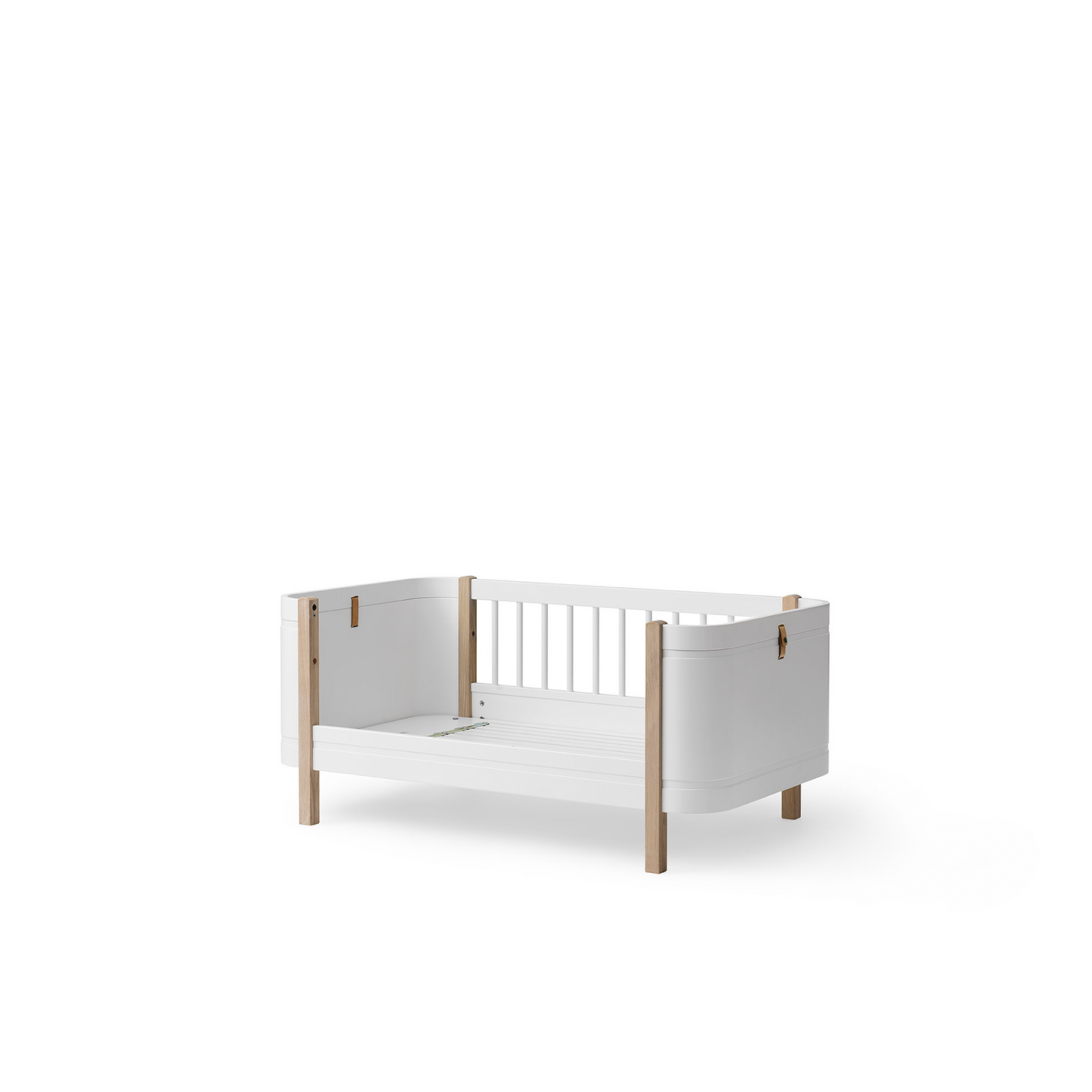 White crib with wooden sides on a white background