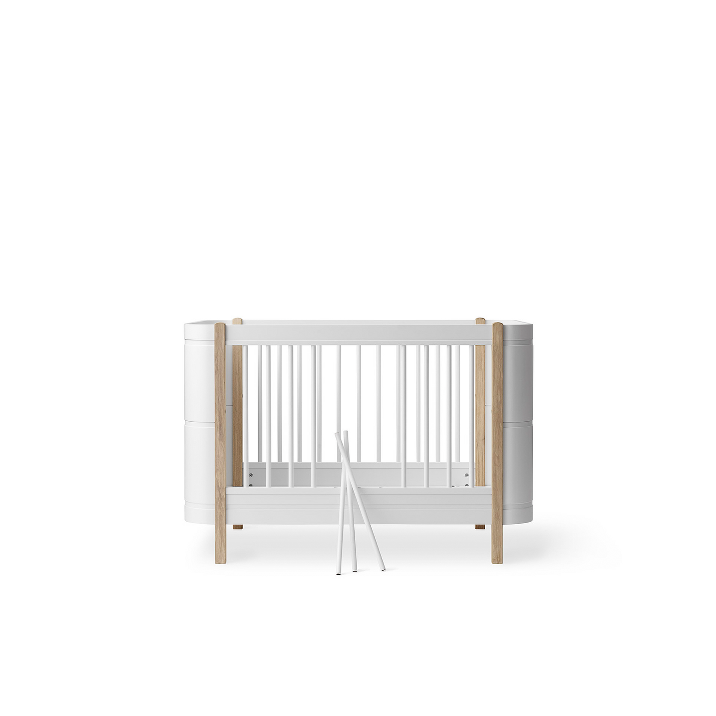 White crib with wooden sides on a white background