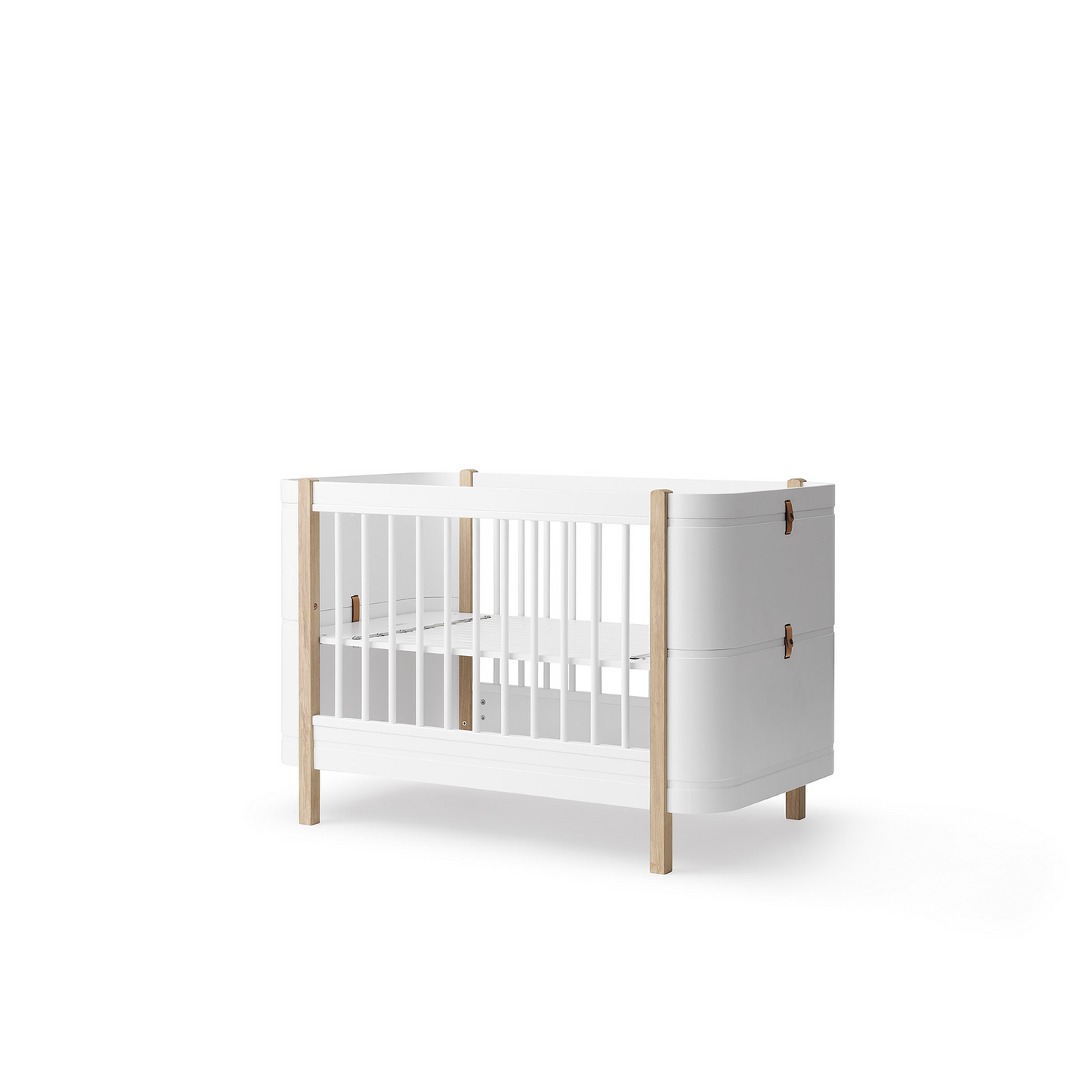 White crib with wooden frame on a white background