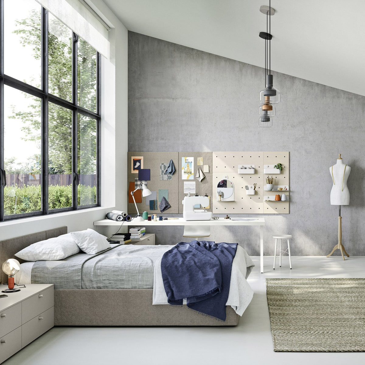 A modern, bright bedroom interior with a bed, desk, shelving, mannequin, and large window, shown as a styled room scene rather than a single isolated product.