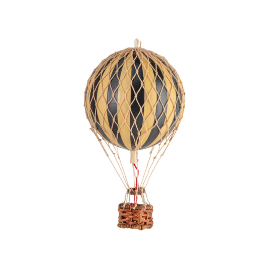 Decorative hot air balloon model with striped design on a white background