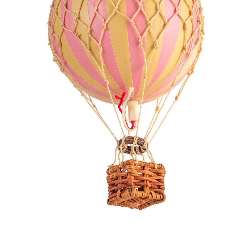 Hot air balloon with pink and yellow striped balloon and wicker basket on a white background