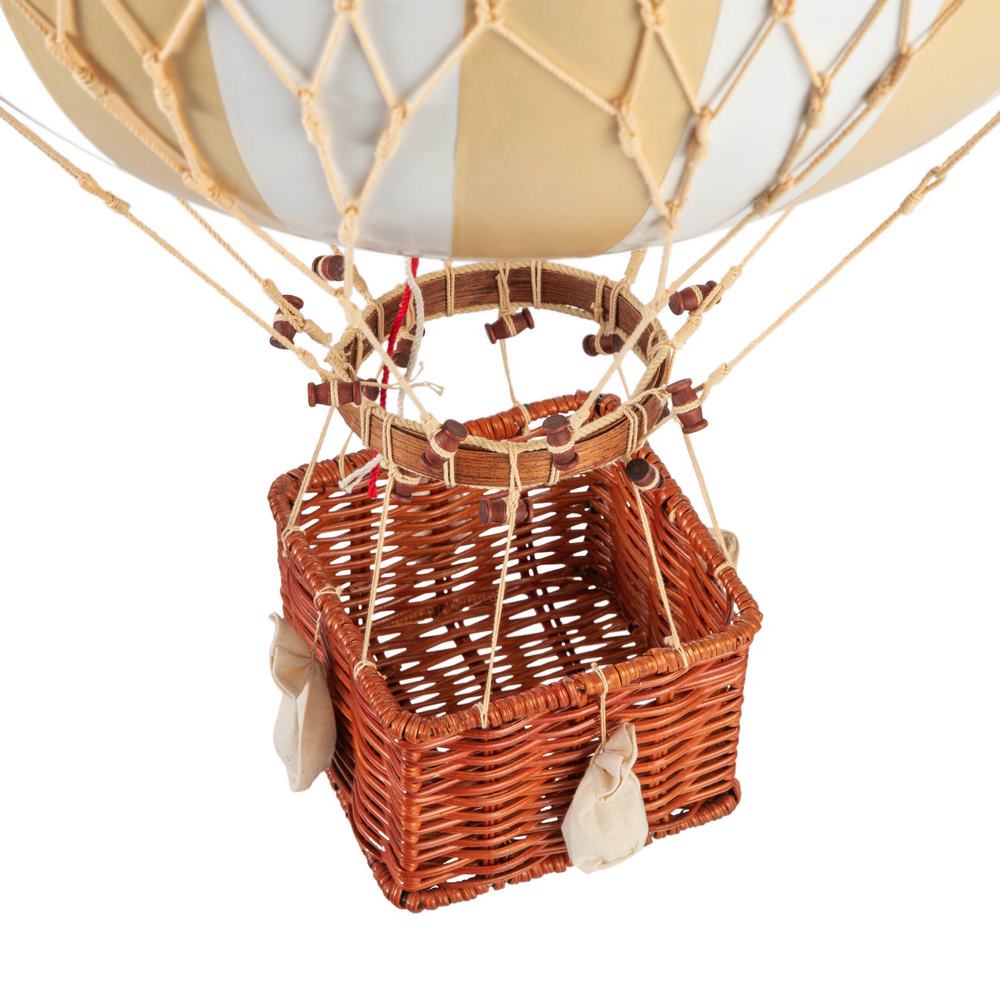 Hot air balloon with wicker basket on a white background