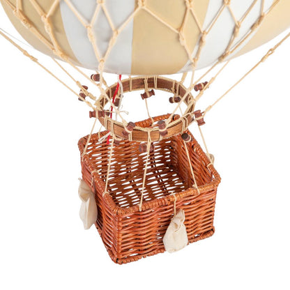 Hot air balloon with wicker basket on a white background
