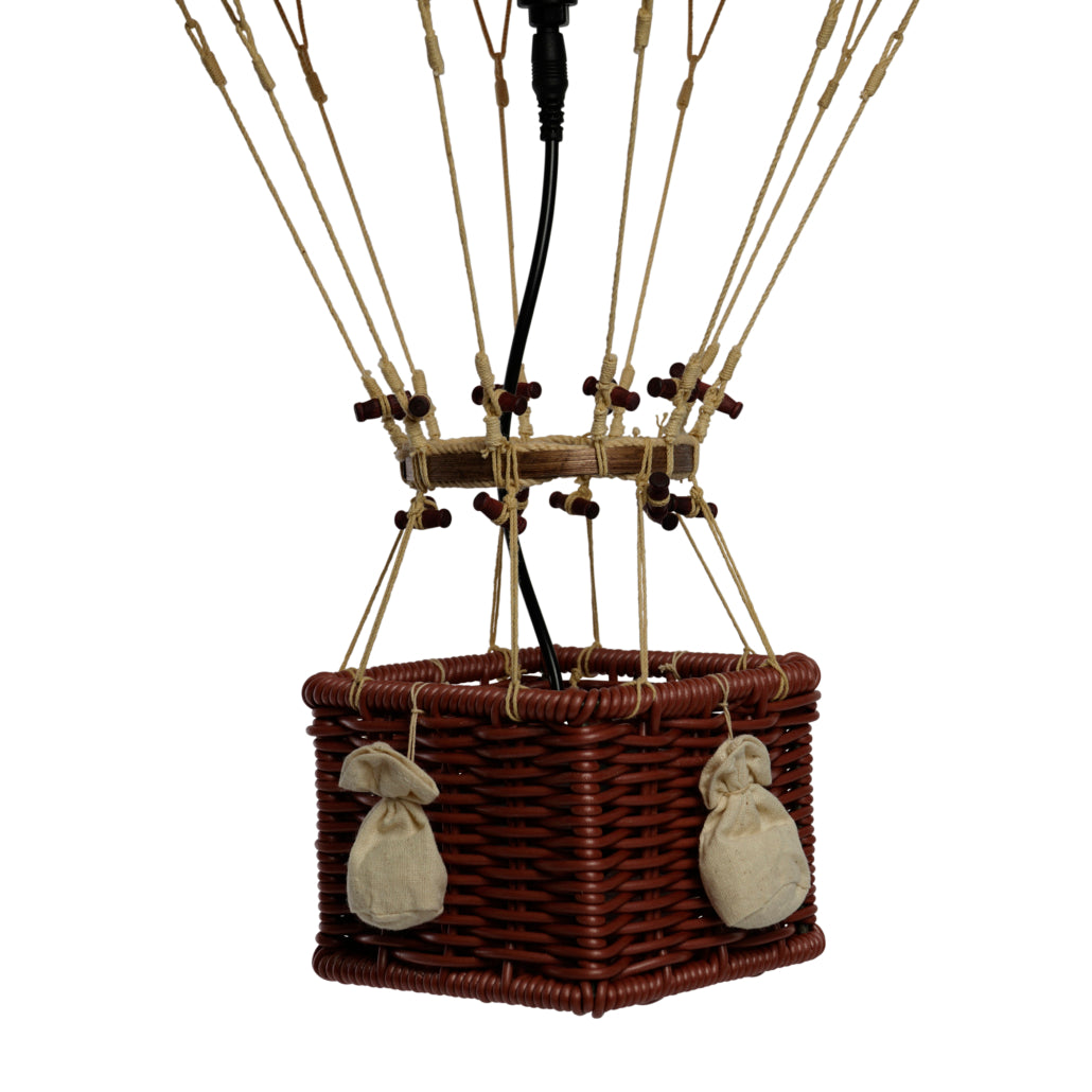 Hot air balloon basket with ropes and bags on a white background