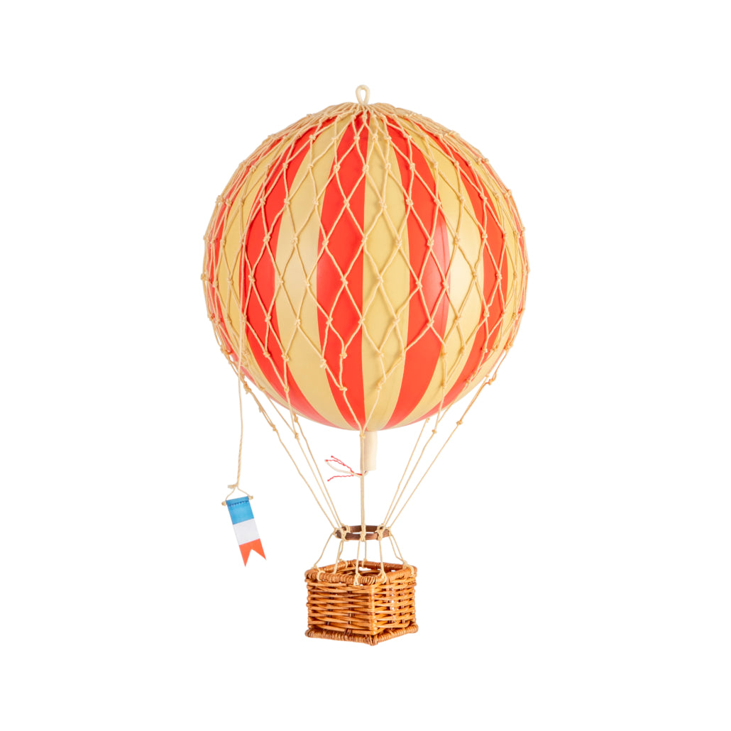 Model hot air balloon with red and yellow striped balloon and wicker basket on a white background