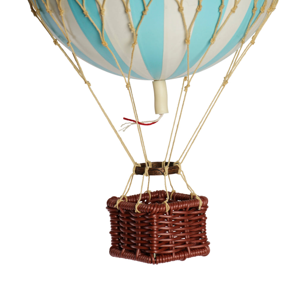 Hot air balloon with a wicker basket on a white background