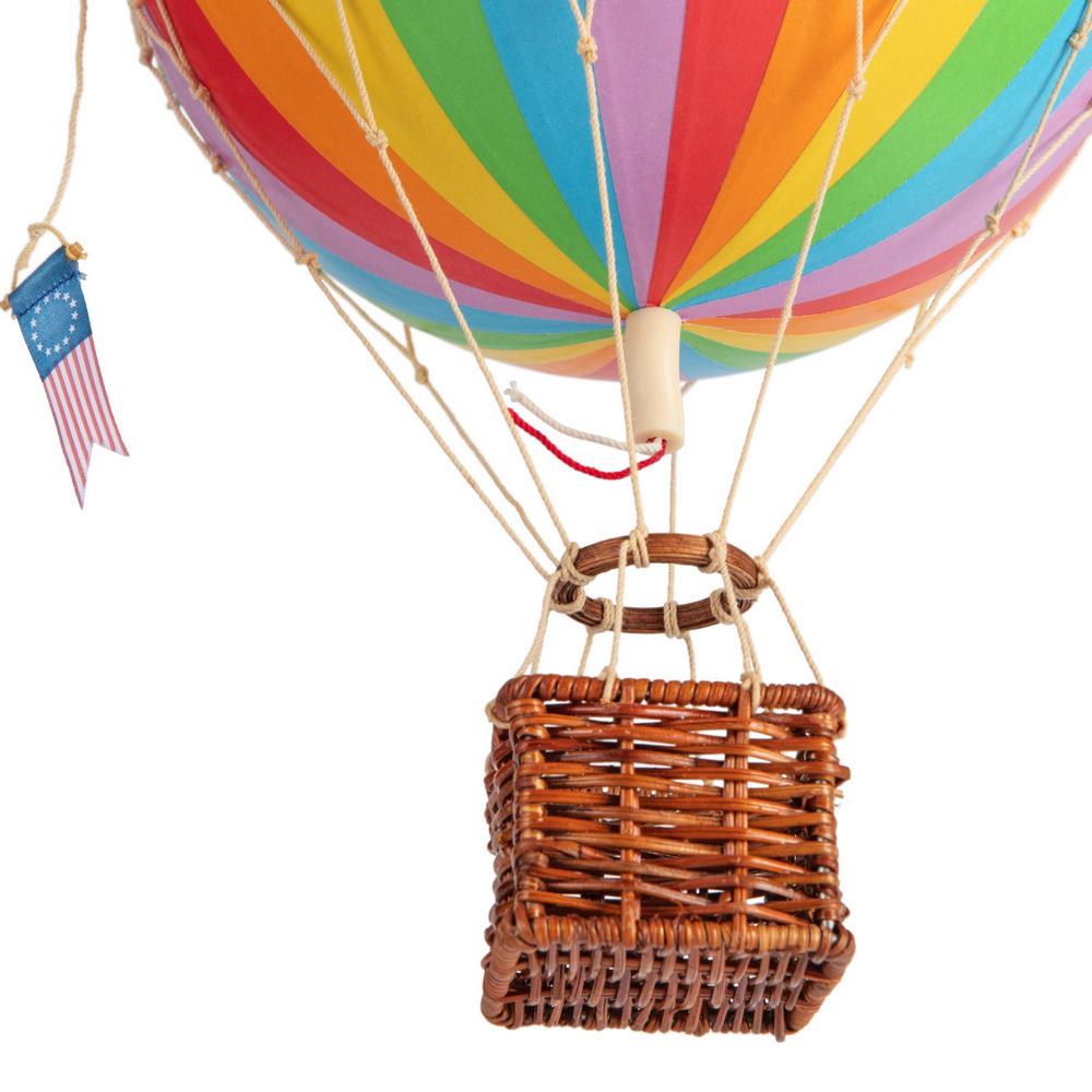Colorful hot air balloon with a wicker basket and American flag on a white background