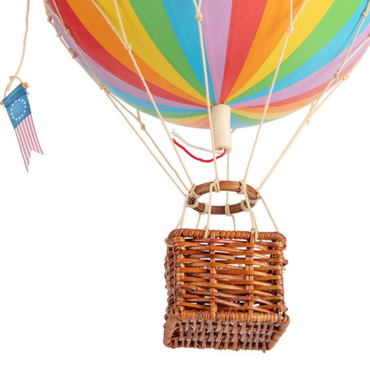 Colorful hot air balloon with a wicker basket and American flag on a white background