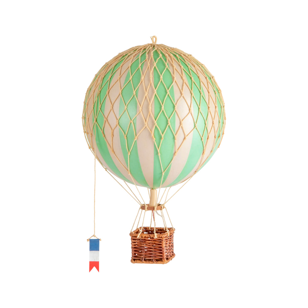Decorative hot air balloon with a basket and flag on a white background