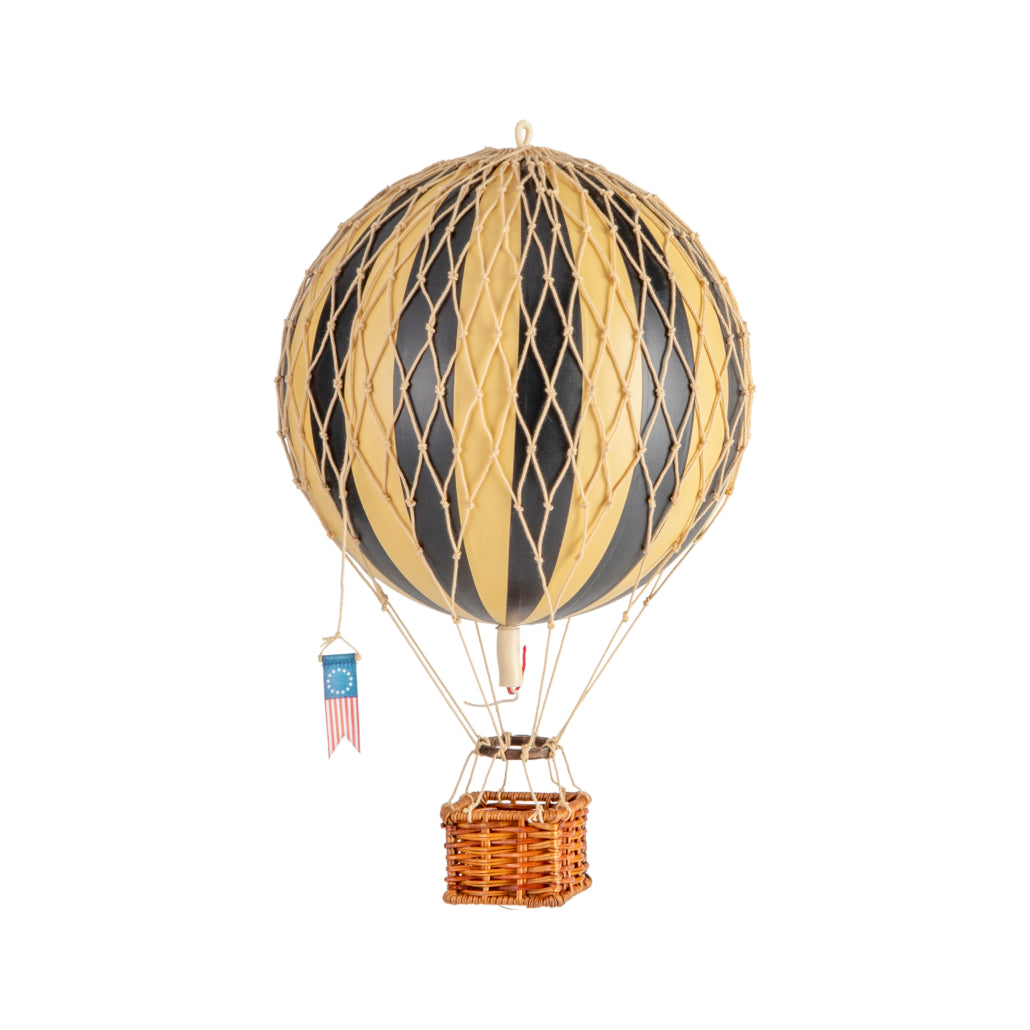 Model hot air balloon with striped design on a white background