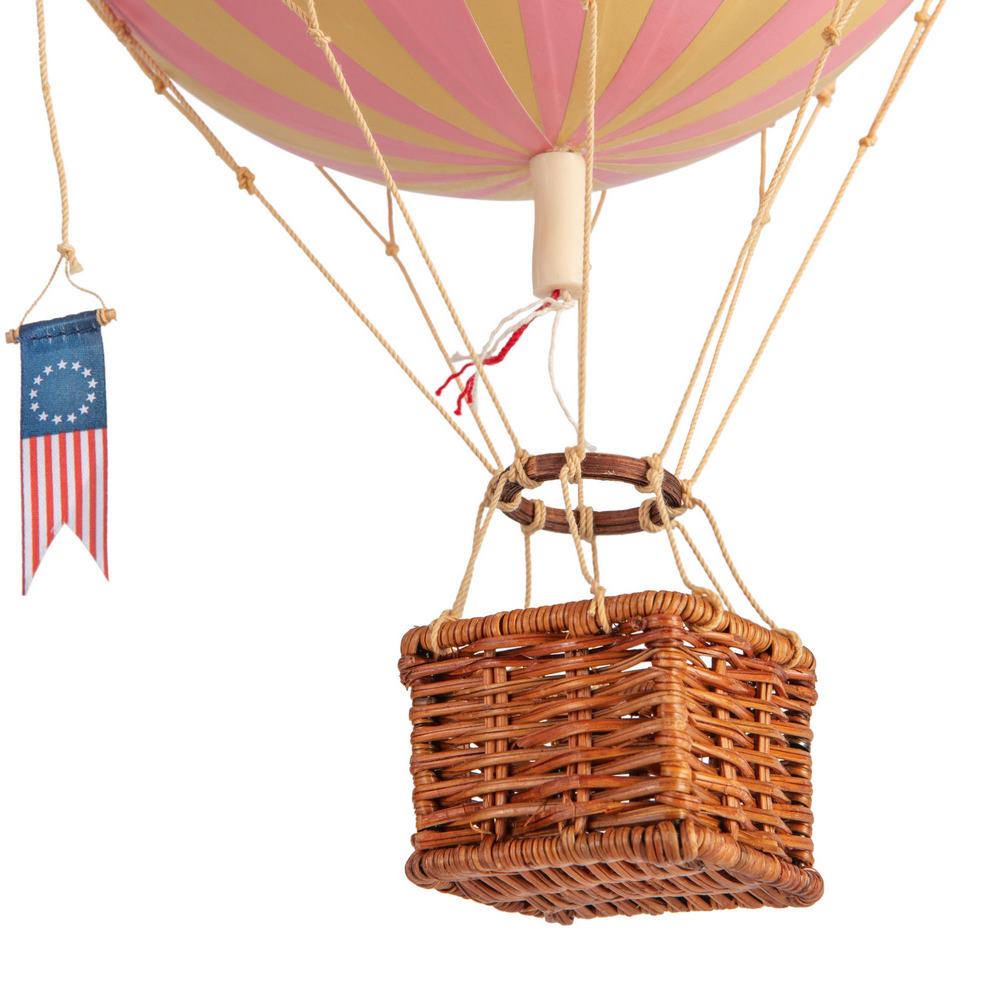 Hot air balloon with a wicker basket and American flag banner on a white background