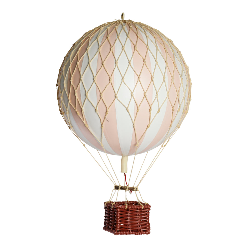 Decorative hot air balloon with a wicker basket on a white background