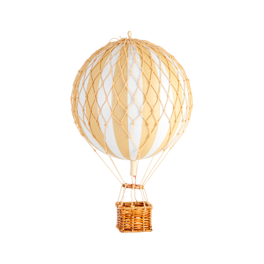 Hot air balloon model with a white balloon and gold basket on a white background