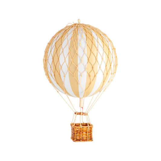 Hot air balloon model with a white balloon and gold basket on a white background