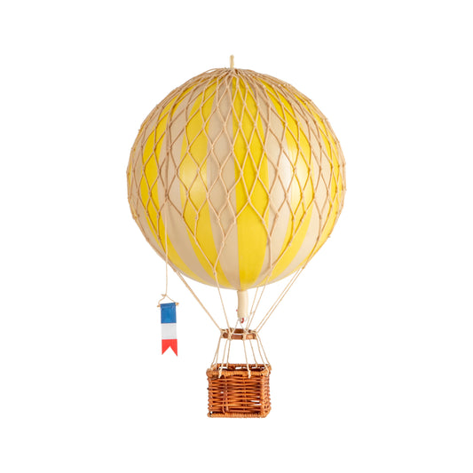 Yellow hot air balloon with a wicker basket on a white background