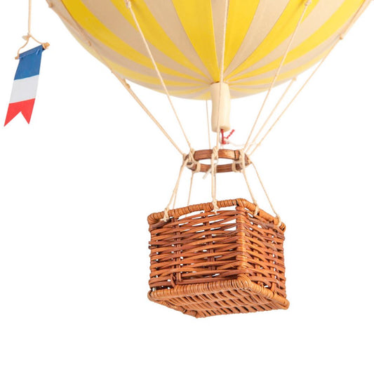 Hot air balloon with a wicker basket on a white background