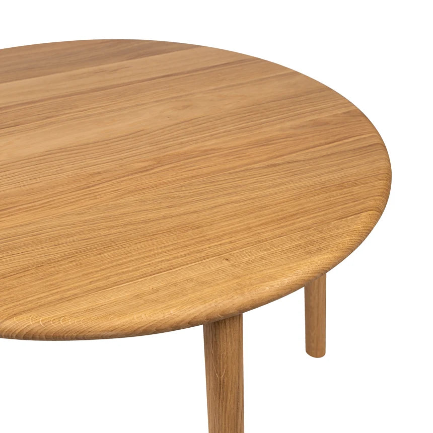 Round wooden table on a white background