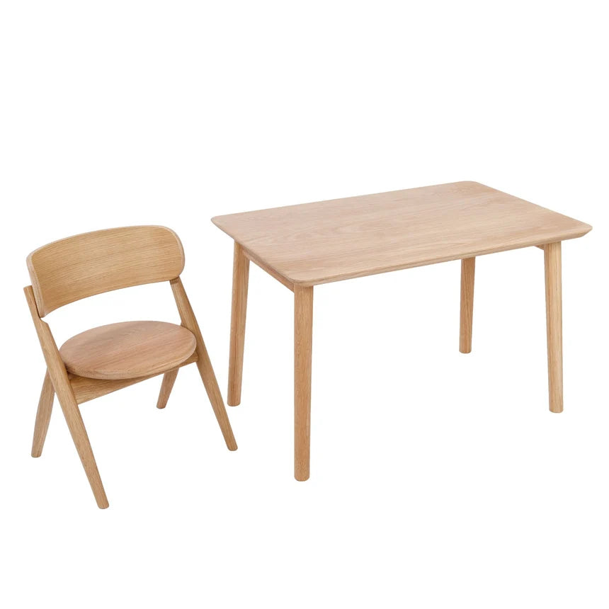 A light natural wood children's table and matching chair set, photographed on a clean white background.