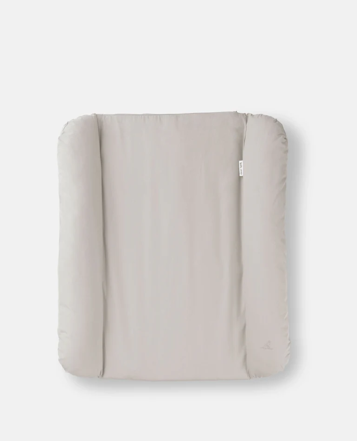Beige quilted cover on a white background