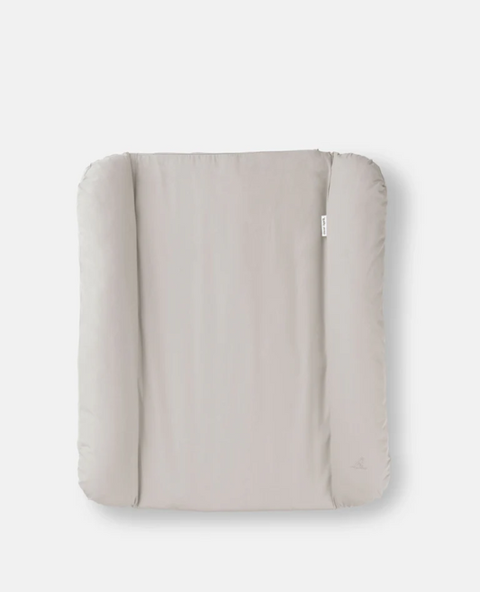 Beige quilted cover on a white background