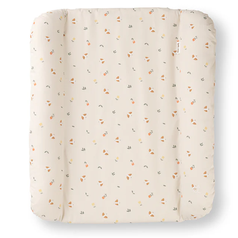 Textured quilted pad with small patterns on a white background