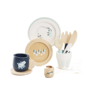 Set of ceramic tableware with decorative elements on a white background