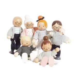 Set of wooden dolls representing a family on a white background