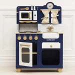 Toy kitchen set with a blue cabinet, white stove, and gold accents on a white background