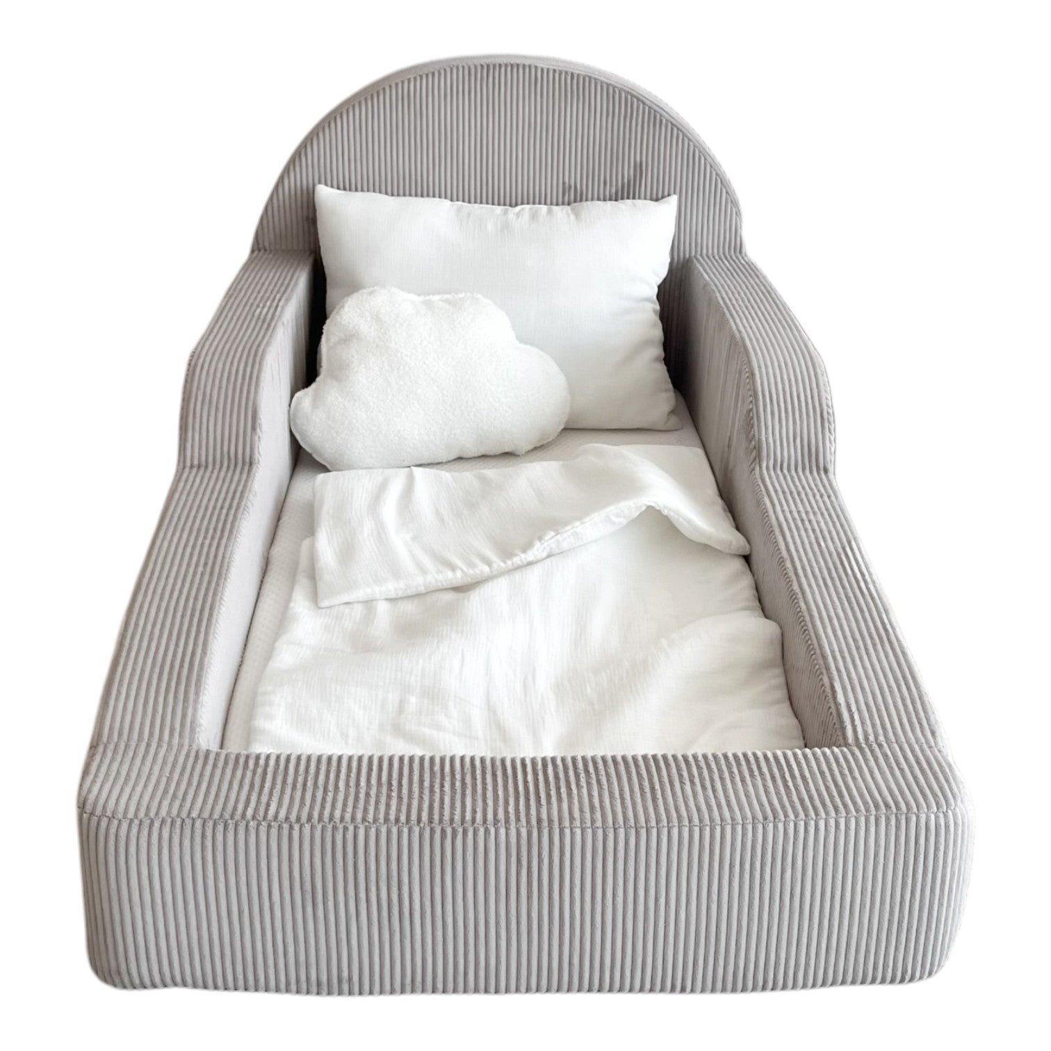A small upholstered kidst bed with a gray corduroy-like striped fabric, shown empty with white bedding and two white pillows inside. 