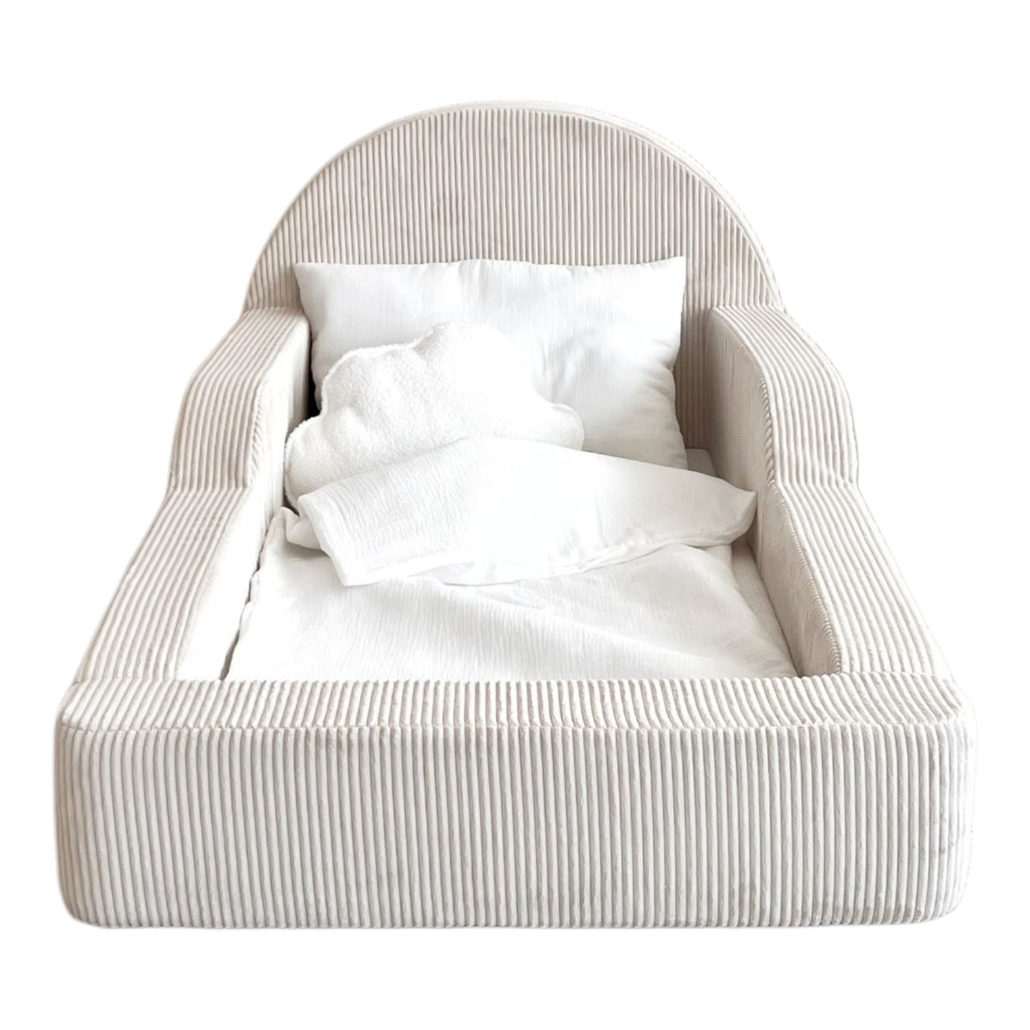 A small upholstered kids bed with a rounded backrest and armrests, shown empty with white bedding and pillows on a plain white background.