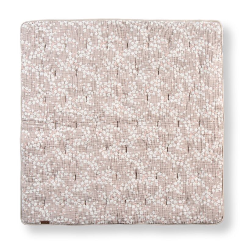 Floral patterned fabric square on a white background