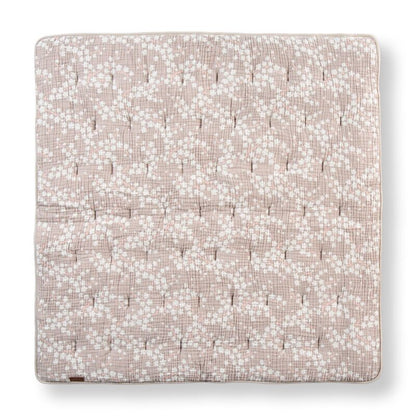 Floral patterned fabric square on a white background