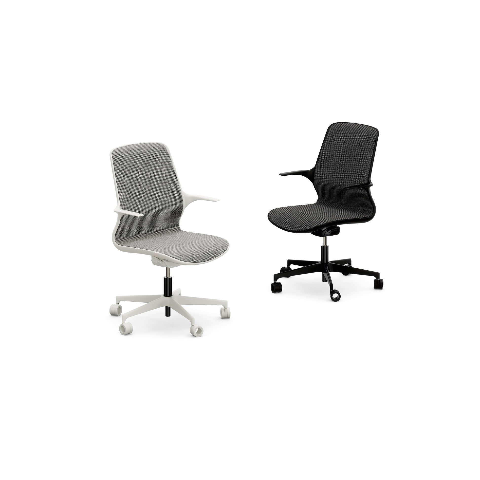 Two Nidi Leaf children’s ergonomic desk chairs with upholstered seats and armrests, one in white and one in black