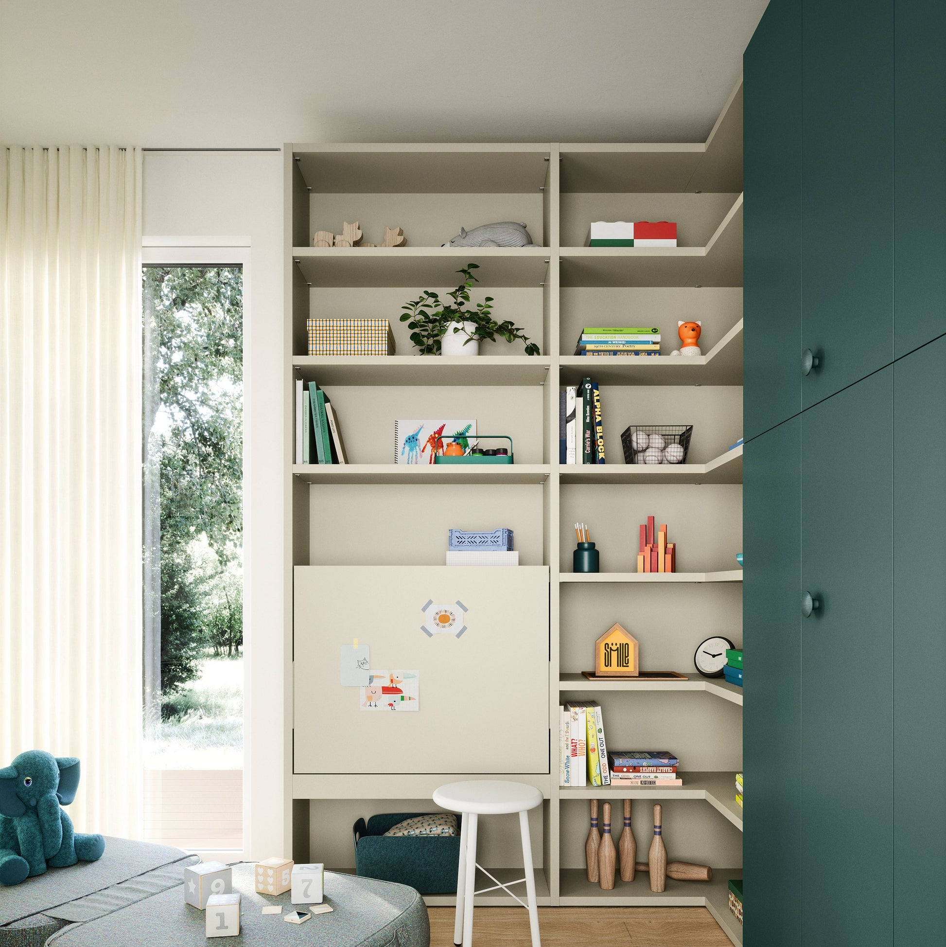 Modern living room with bookshelves, green wall, and children's toys.