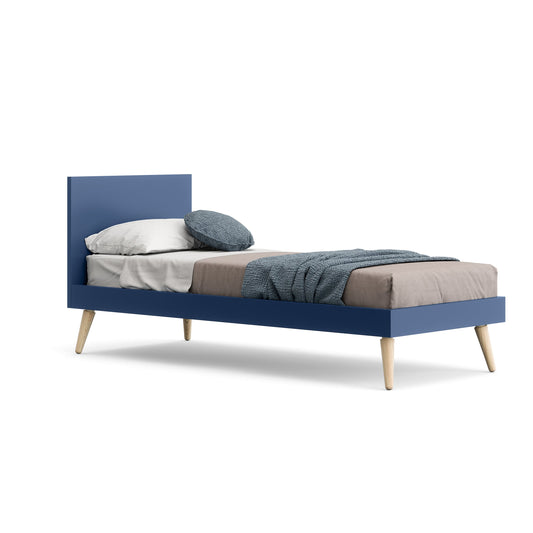 Blue bed with beige mattress and pillows on a white background