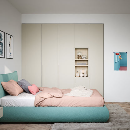Modern bedroom with a bed, wardrobe, and decorative items.