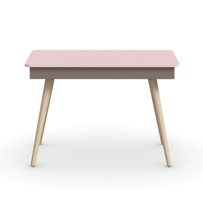 Pink table with wooden legs on a white background, featuring the brand 'nidi'.
