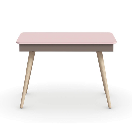 Pink table with wooden legs on a white background, featuring the brand 'nidi'.