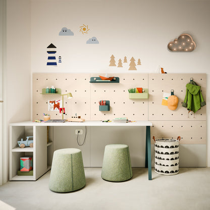 Nidi kids desk with pegboard wall, modular shelves, and twin stools in a modern children’s study space