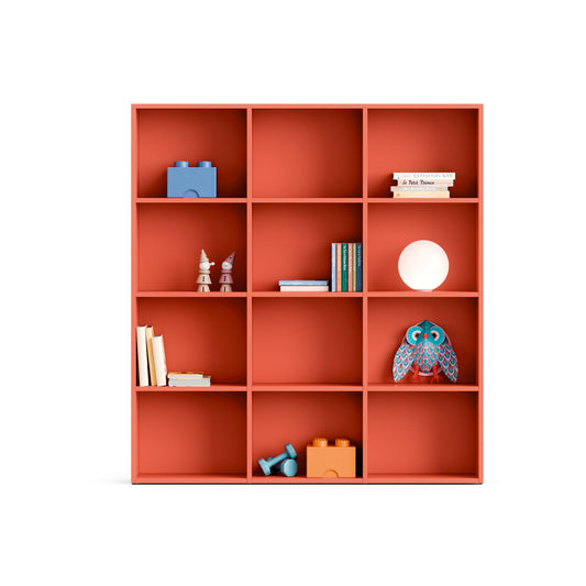 Red bookshelf with various items on a white background