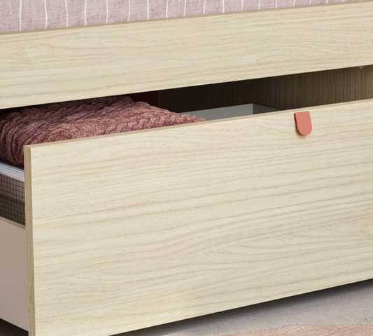 Wooden bed with a drawer open, revealing a folded blanket inside.