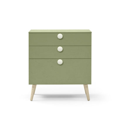 Green dresser with white knobs on a white background