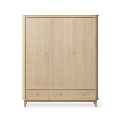 Wooden wardrobe with four doors and two drawers on a white background