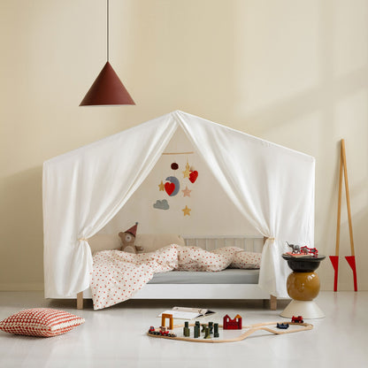 Children's bedroom with a canopy bed, toys, and a pendant light.