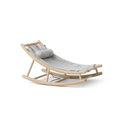 Modern rocking chair with a gray cushion on a white background